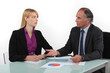Photo: Businesspeople looking at financial results Businesspeople looking at financial results