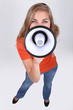 Photo: young woman talking through a megaphone young woman talking through a megaphone