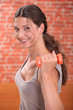 Photo: Brunette woman lifting weights Brunette woman lifting weights