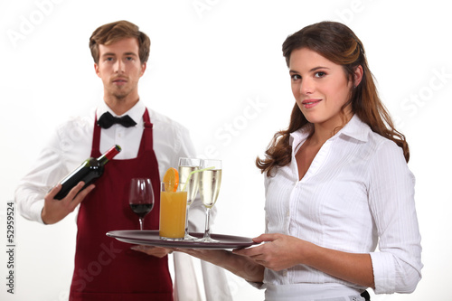 Photo: Wine waiter and waitress, studio shot Wine waiter and waitress, studio shot