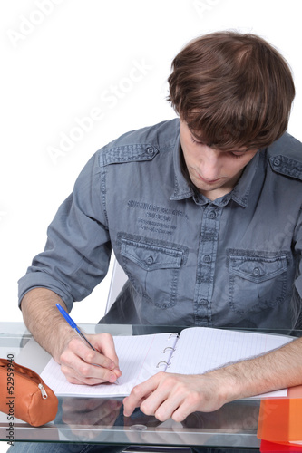 Photo: Male student at a desk Male student at a desk