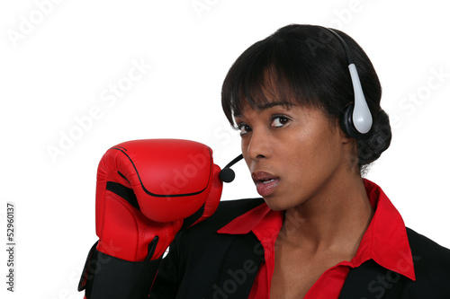 Photo: Call center worker with boxing gloves Call center worker with boxing gloves