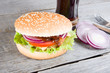 Hamburger with onion and drink