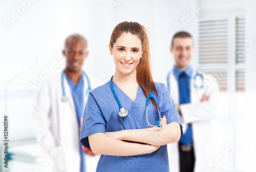Photo: Nurse in front of her medical team Nurse in front of her medical team