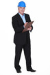 portrait of middle-aged architect holding clipboard