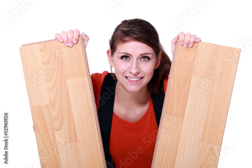 Photo: craftswoman holding two laminated boards craftswoman holding two laminated boards