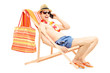 Foto: Man enjoying on a sun lounger while talking on a mobile phone Man enjoying on a sun lounger while talking on a mobile phone