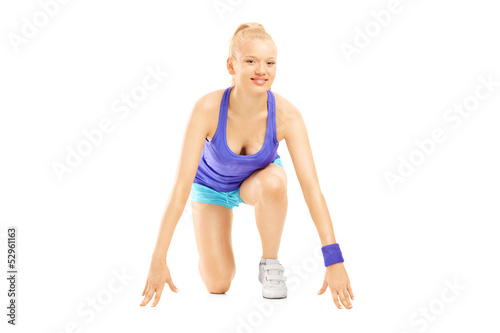 Photo: A female athlete ready to run A female athlete ready to run