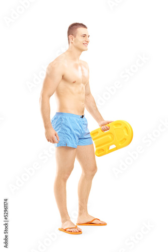Photo: Full length portrait of a male lifeguard on duty posing Full length portrait of a male lifeguard on duty posing