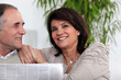 Foto: Senior couple reading the newspaper Senior couple reading the newspaper