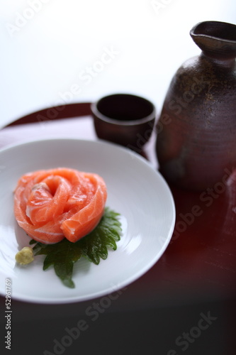 Photo: Japanese food, salmon sashimi and sake Japanese food, salmon sashimi and sake