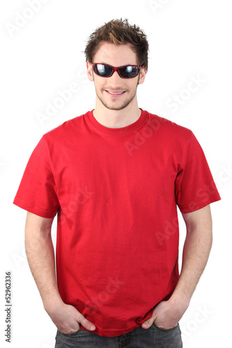 Photo: Man dressed in a red t-shirt and wearing sunglasses Man dressed in a red t-shirt and wearing sunglasses