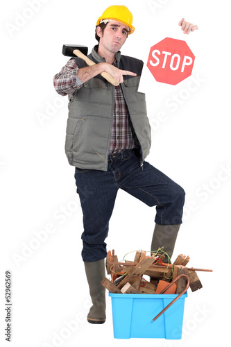 Photo: Builder with a Stop sign Builder with a Stop sign