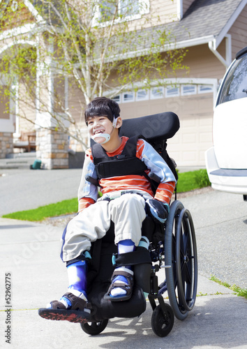 Photo: Happy little disabled boy in wheelchair Happy little disabled boy in wheelchair