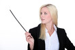 Photo: Woman in suit holding stick Woman in suit holding stick