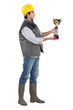 Photo: Construction worker with an award Construction worker with an award