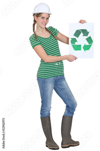 Photo: Woman holding recycle logo Woman holding recycle logo