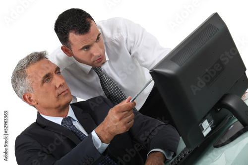 Photo: duo of businessmen with computer duo of businessmen with computer