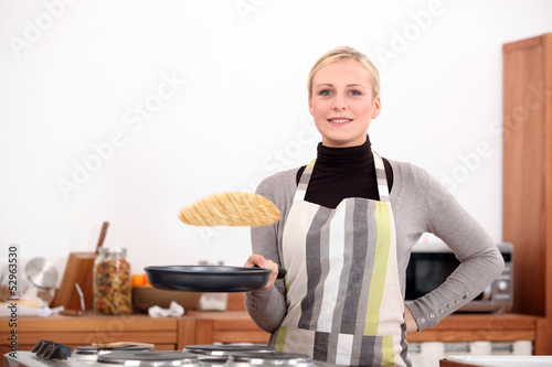 Photo: Woman making pancakes Woman making pancakes
