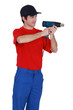 Man holding hand-held electric heater