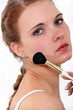Photo: Woman putting make up on Woman putting make up on