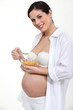 Photo: Pregnant woman eating cereal Pregnant woman eating cereal