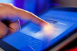 Photo: Closeup of finger touching tablet-pc screen Closeup of finger touching tablet-pc screen