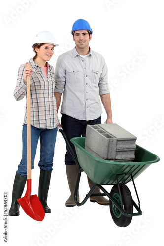 Photo: Young couple ready for construction works Young couple ready for construction works