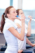 Women drinking water after sports