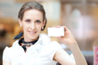 Business woman showing her blank business card