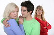 Photo: Woman jealous of couple hugging Woman jealous of couple hugging