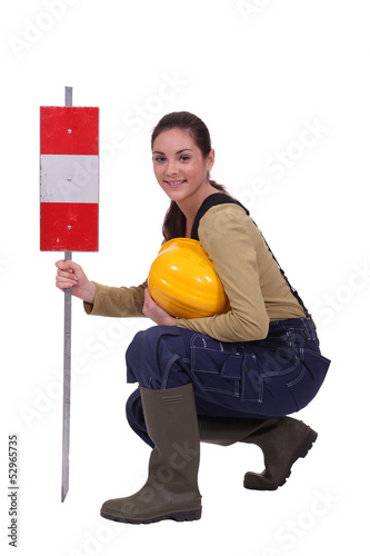 Photo: Construction work with a warning sign Construction work with a warning sign