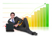 Businessman laying with laptop in front of bar chart
