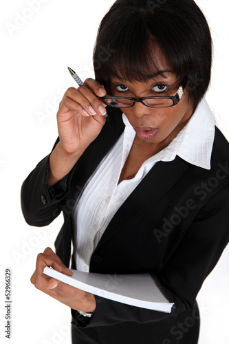 Photo: Businesswoman with notepad and pen Businesswoman with notepad and pen