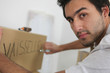 Photo: Man packing dishes Man packing dishes