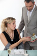 Surprised woman receiving a gift from her boyfriend