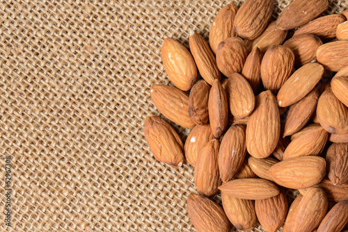 Photo: Almonds on a Burlap Background Almonds on a Burlap Background