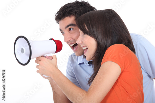 Photo: Teens with loudspeaker Teens with loudspeaker