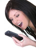 Photo: angry woman shouting on her mobile phone angry woman shouting on her mobile phone