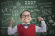 Asian student boy show thumbs up in class