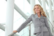 Businesswoman smiling on steps