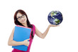 Beautiful female student holds globe isolated on white