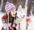 Young woman with dog winter outdoors fun
