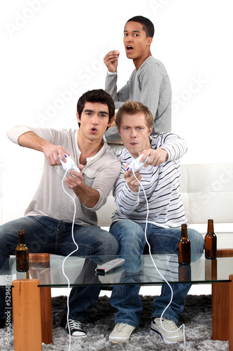 Photo: Young men playing computer games Young men playing computer games