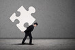 Photo: Businessman build puzzle Businessman build puzzle