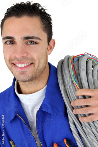 Photo: Portrait of a young electrician Portrait of a young electrician
