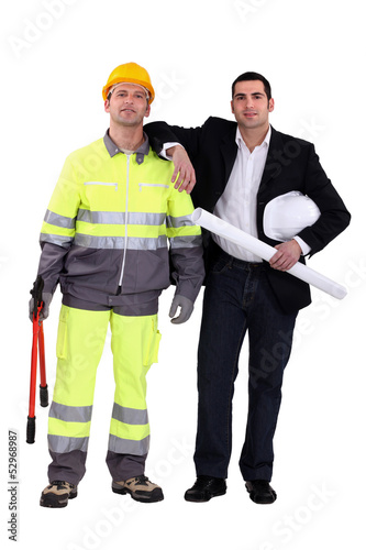 Photo: businessman and craftsman posing together businessman and craftsman posing together