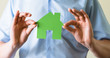 Paper house in the hands