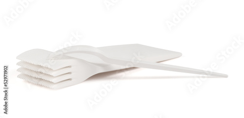 Photo: Disposable white plastic forks isolated Disposable white plastic forks isolated