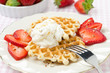 Belgian waffles with fresh strawberries and whipped cream